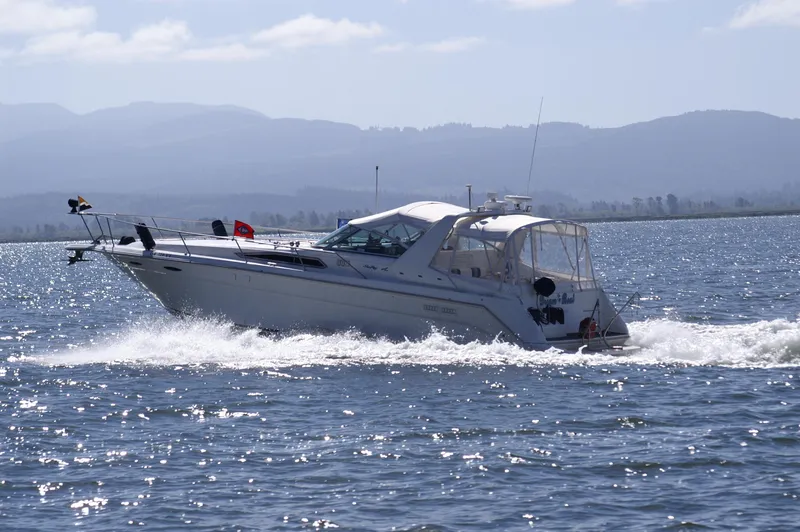 Slide: The Image of 1993 Sea Ray Sundancer 370 cruising on open water. - 0