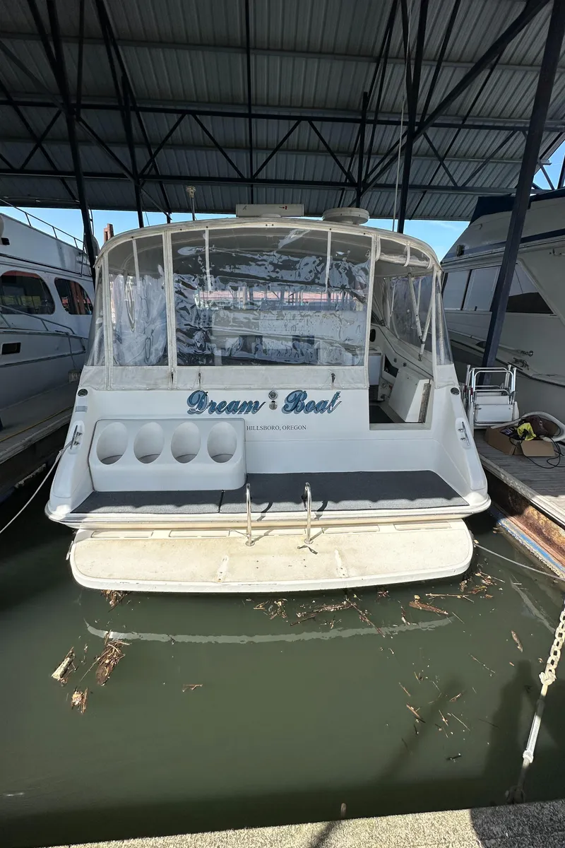 Slide: The Image of 1993 Sea Ray Sundancer 370 boat docked in marina. - 10