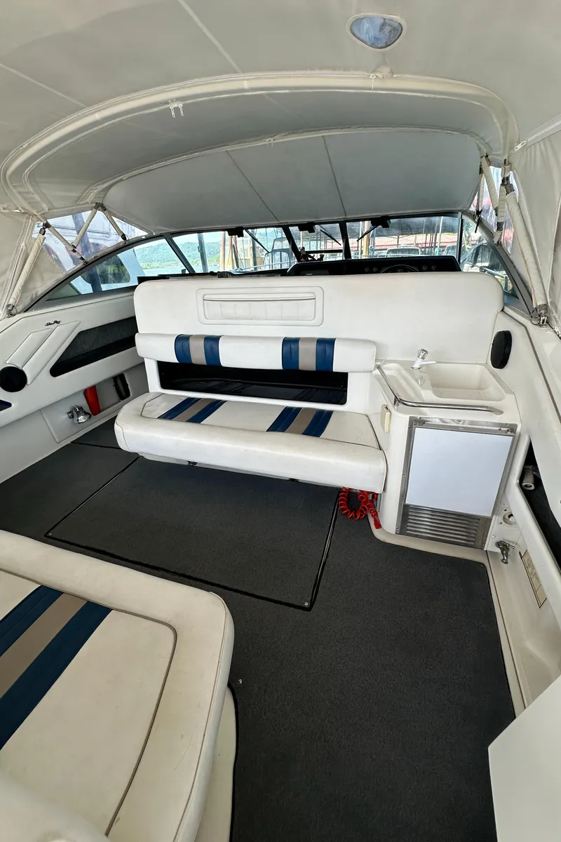 Slide: The Image of Interior of a 1993 Sea Ray Sundancer 370 yacht with seating area. - 11