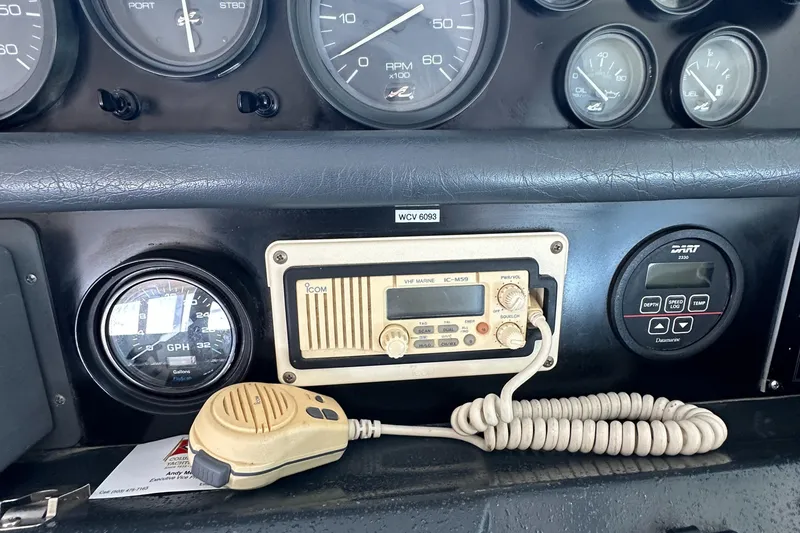 Slide: The Image of Dashboard of a 1993 Sea Ray Sundancer 370 with radio equipment. - 13