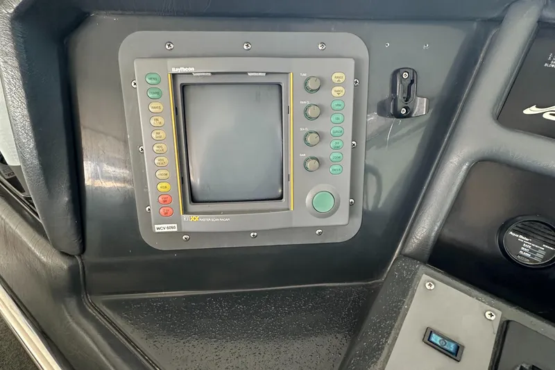 Slide: The Image of Dashboard of a 1993 Sea Ray Sundancer 370 with navigation system. - 15