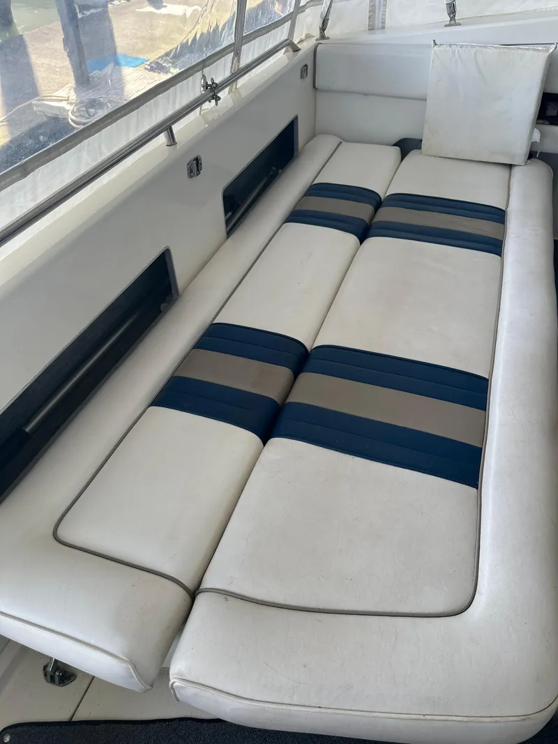 Slide: The Image of Interior of 1993 Sea Ray Sundancer 370 yacht with cushioned seating. - 18