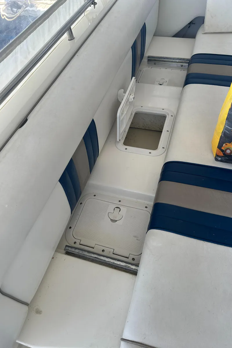 Slide: The Image of Interior of 1993 Sea Ray Sundancer 370 with seating and storage compartments. - 19