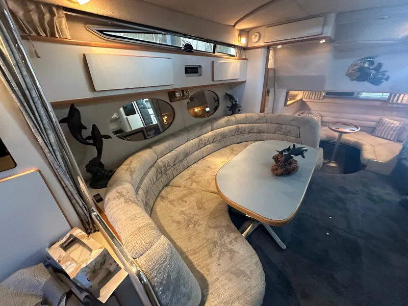 Slide: The Image of Interior of a 1993 Sea Ray Sundancer 370 yacht with elegant seating area. - 22