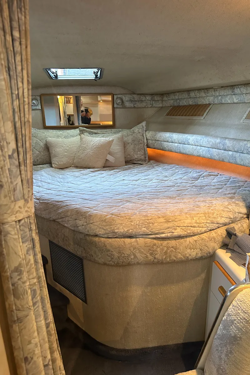 Slide: The Image of Interior of 1993 Sea Ray Sundancer 370 yacht featuring a cozy bed. - 26