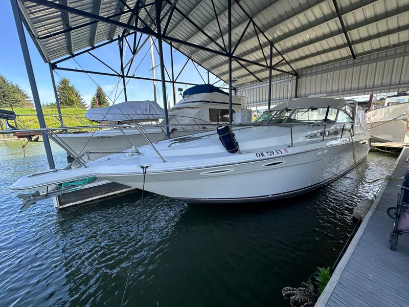 Slide: The Image of 1993 Sea Ray Sundancer 370 docked under covered marina. - 3