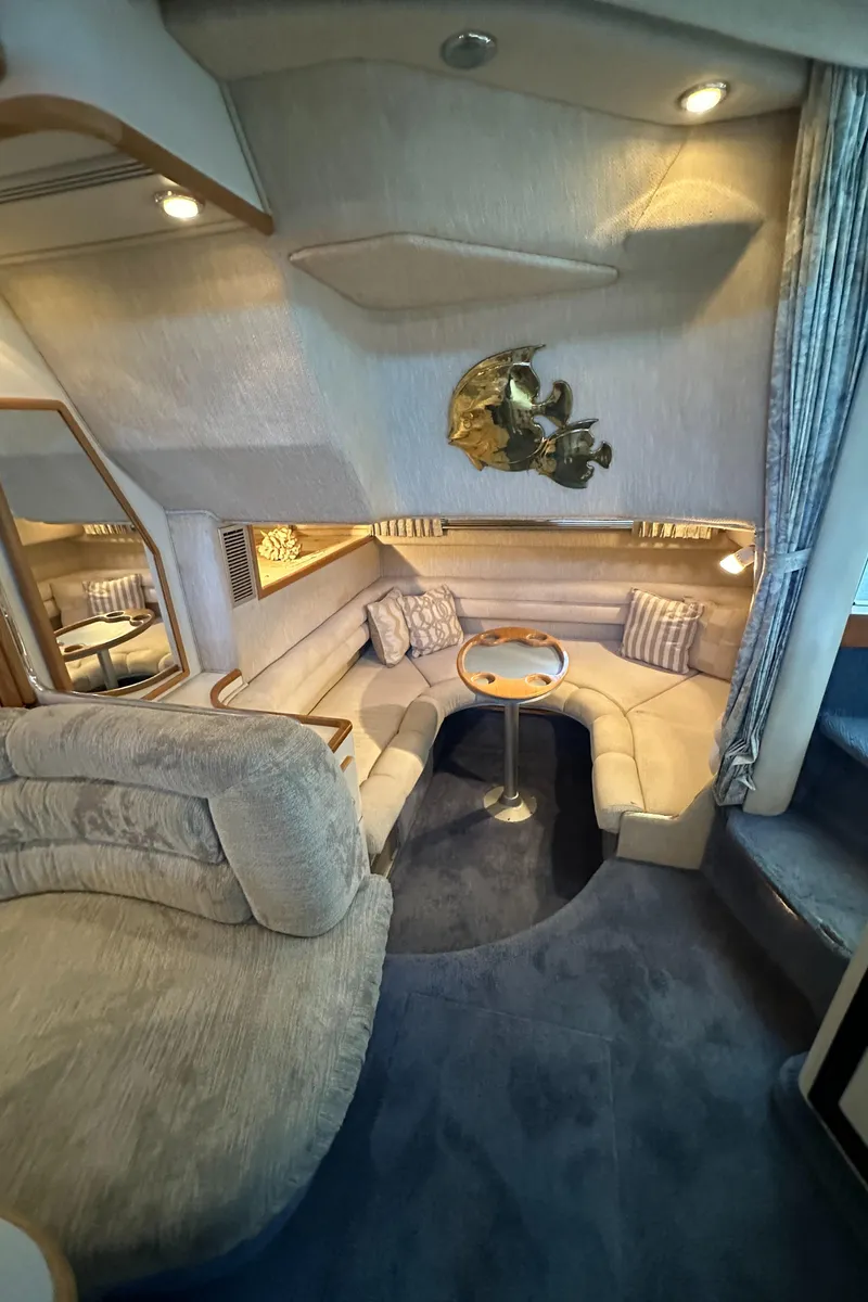 Slide: The Image of Interior of a 1993 Sea Ray Sundancer 370 yacht, cozy seating area. - 31