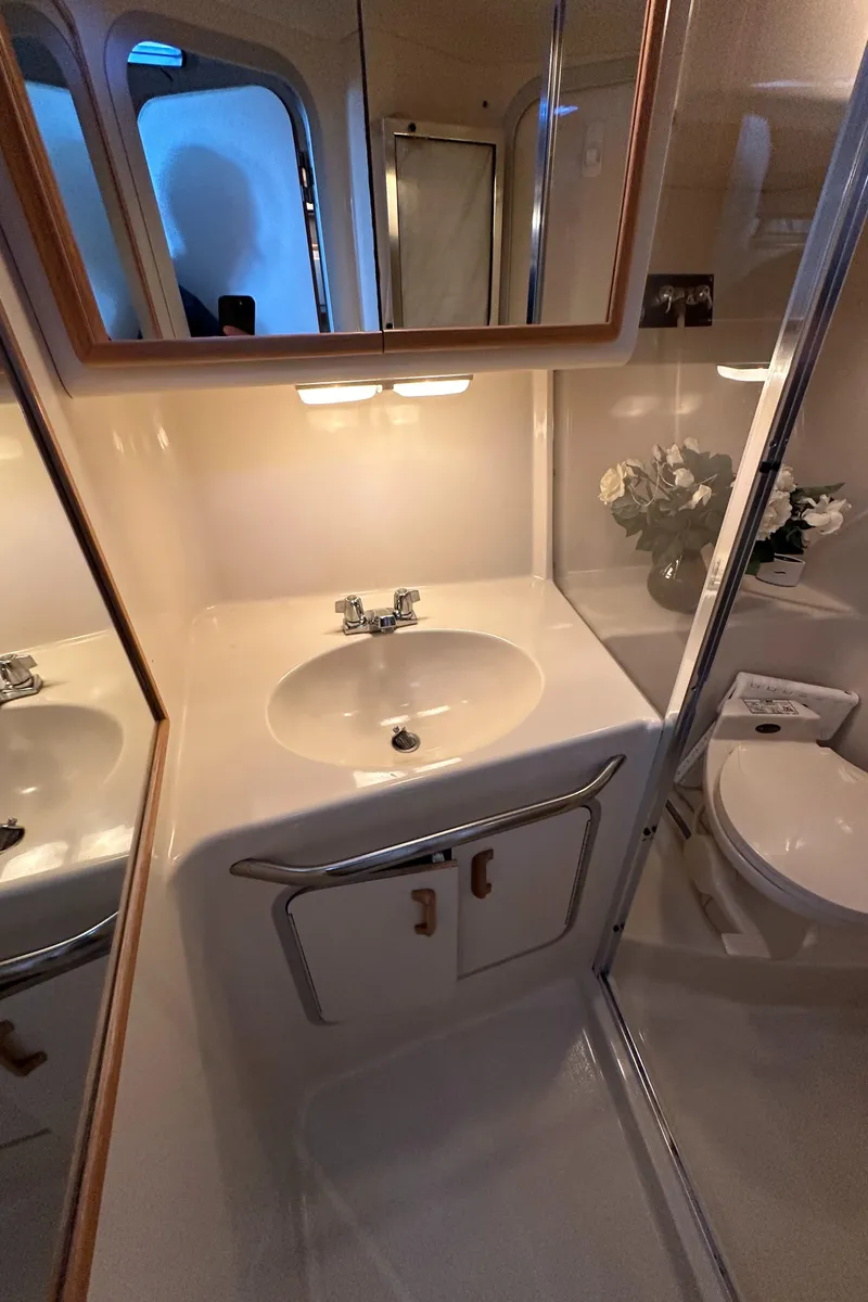 Slide: The Image of Bathroom in 1993 Sea Ray Sundancer 370 with sink and mirror. - 34