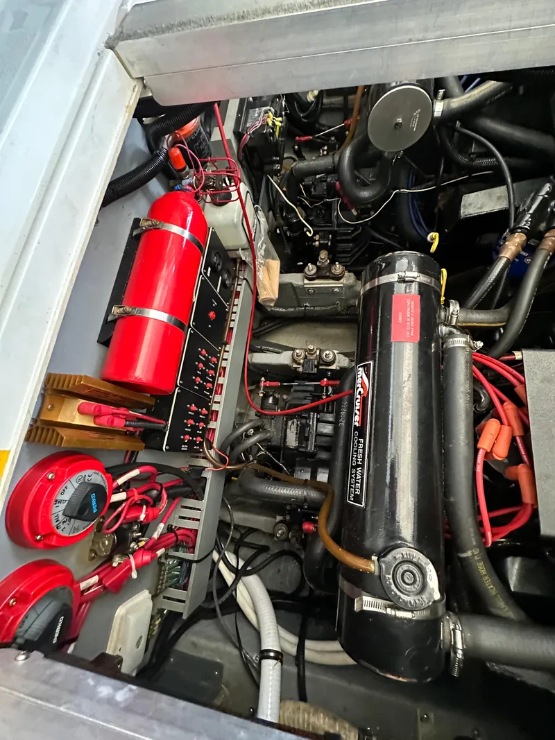 Slide: The Image of Engine compartment of a 1993 Sea Ray Sundancer 370 boat with technical components. - 36
