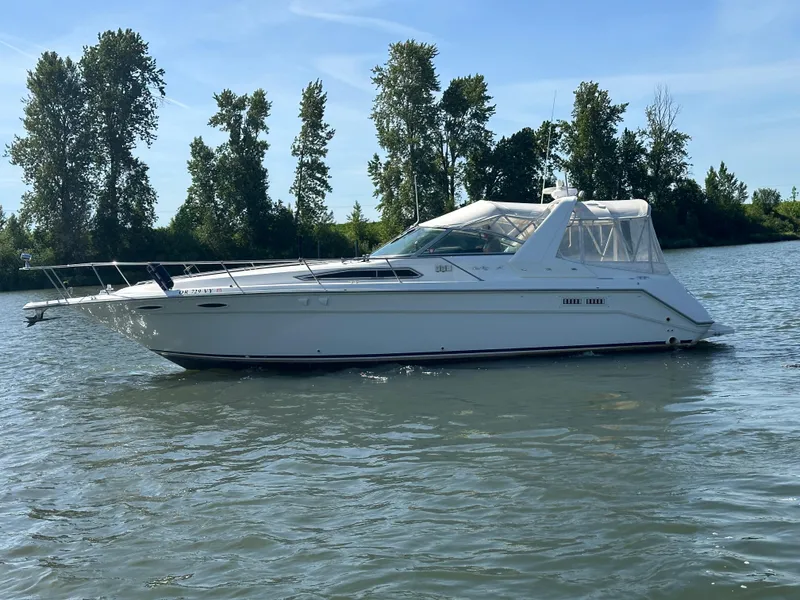 Slide: The Image of 1993 Sea Ray Sundancer 370 on calm water with trees in background. - 40