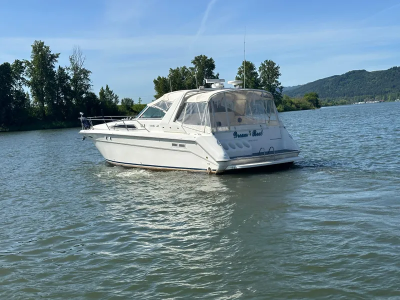 Slide: The Image of 1993 Sea Ray Sundancer 370 on a tranquil lake. - 5