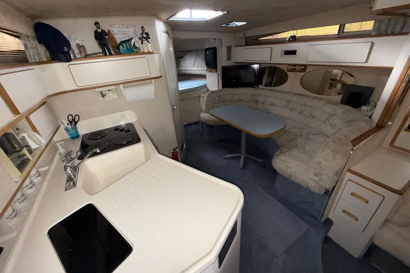 Slide: The Image of Interior of 1993 Sea Ray Sundancer 370 yacht with kitchen and seating area. - 54