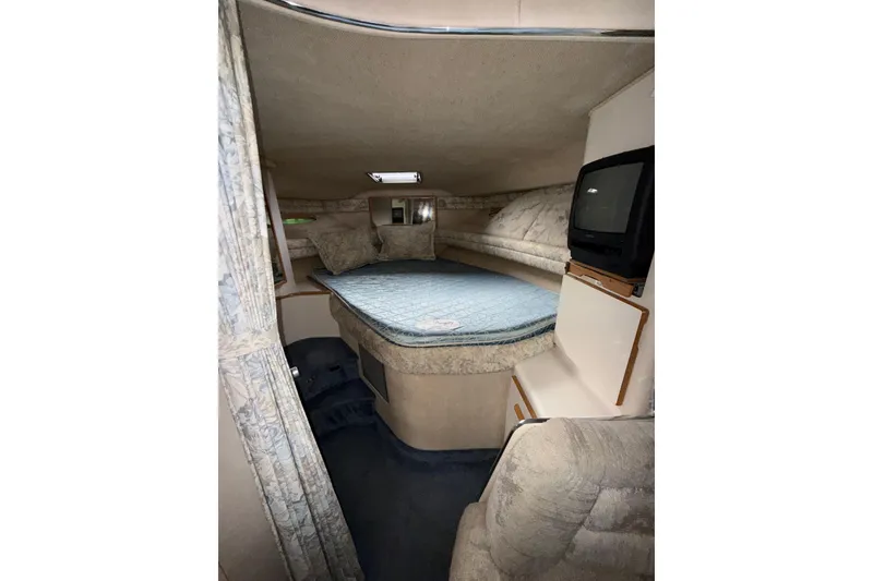 Slide: The Image of Interior cabin of 1993 Sea Ray Sundancer 370 with bed and TV. - 55