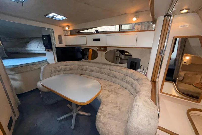 Slide: The Image of Interior of 1993 Sea Ray Sundancer 370 yacht with cozy seating and dining area. - 58