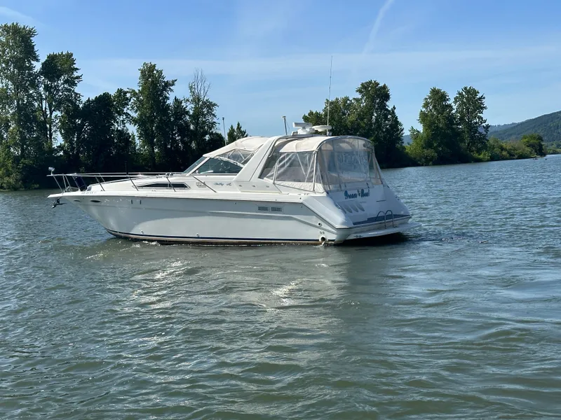 Slide: The Image of 1993 Sea Ray Sundancer 370 on calm waters. - 6