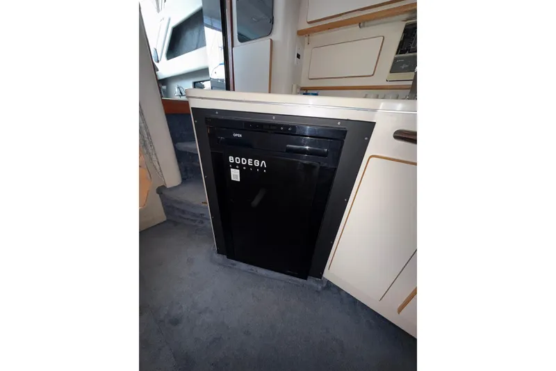 Slide: The Image of Interior of 1993 Sea Ray Sundancer 370 with Bodega cooler in kitchenette. - 60