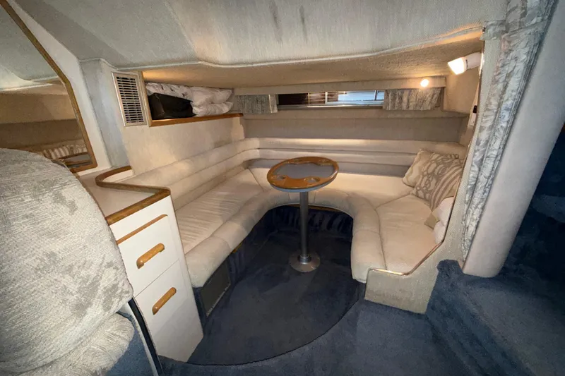 Slide: The Image of Interior of 1993 Sea Ray Sundancer 370, featuring cozy seating and elegant design. - 62