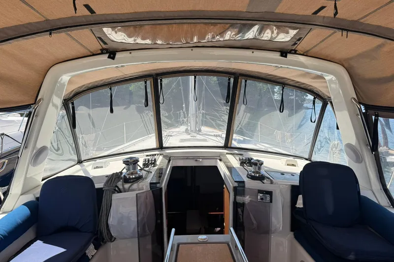 Slide: The Image of Interior view of 2014 Beneteau Oceanis 45 sailboat cockpit with seating and navigation equipment. - 11