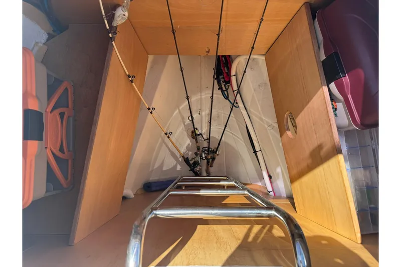 Slide: The Image of Storage area on a 2014 Beneteau Oceanis 45 yacht with fishing rods and equipment. - 16