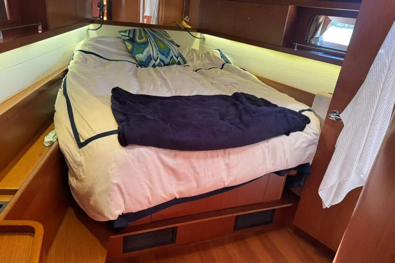 Slide: The Image of Cozy cabin interior of 2014 Beneteau Oceanis 45 sailboat with skylights and bedding. - 19
