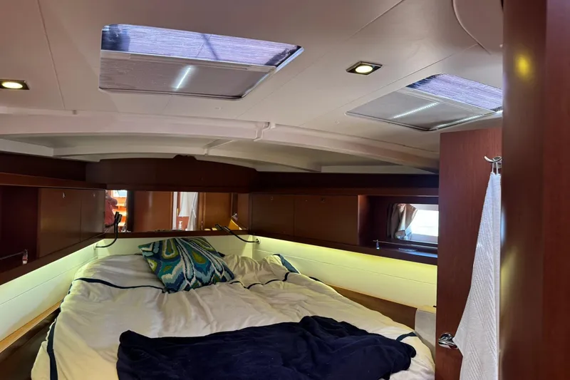 Slide: The Image of Interior of 2014 Beneteau Oceanis 45 yacht with cozy seating and nautical decor. - 21