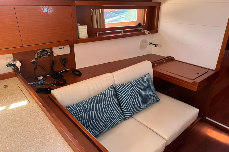 Slide: The Image of Luxurious cabin interior of 2014 Beneteau Oceanis 45 yacht with skylights and cozy bedding. - 23