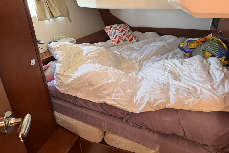 Slide: The Image of Cozy cabin interior of 2014 Beneteau Oceanis 45 yacht with comfortable bedding. - 24