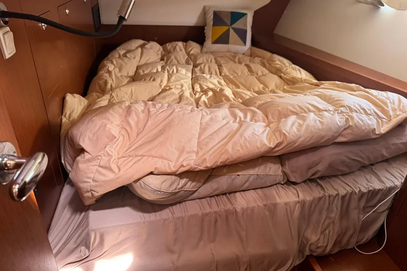 Slide: The Image of Cozy cabin interior of 2014 Beneteau Oceanis 45 sailboat with wooden finish. - 25