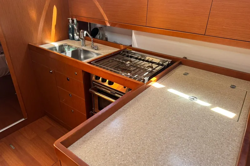 Slide: The Image of Cozy cabin interior of 2014 Beneteau Oceanis 45 sailboat with comfortable bedding. - 26