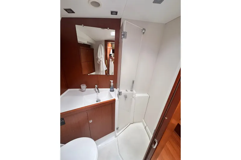 Slide: The Image of Bathroom interior of 2014 Beneteau Oceanis 45 yacht, featuring shower and vanity. - 37