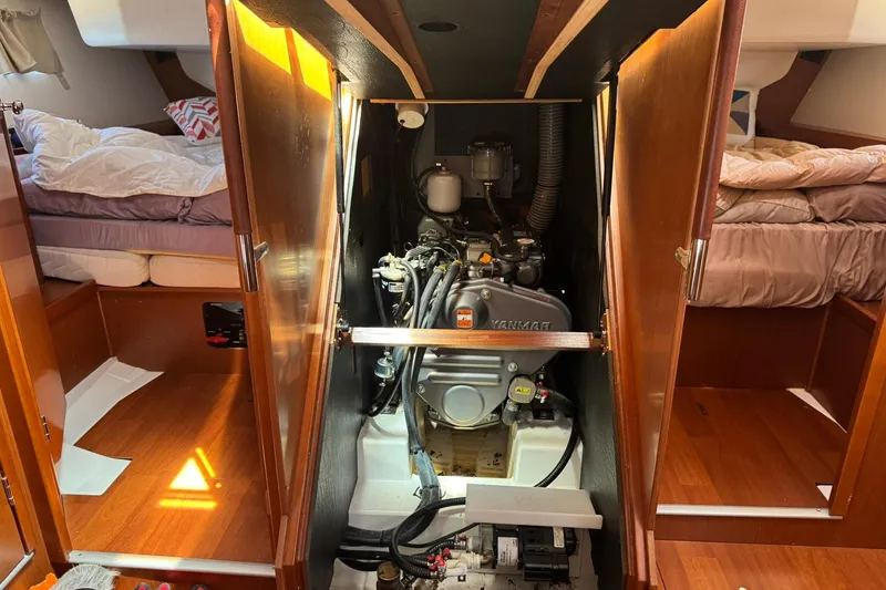 Slide: The Image of Engine compartment of a 2014 Beneteau Oceanis 45 sailboat, showcasing Yanmar engine. - 38