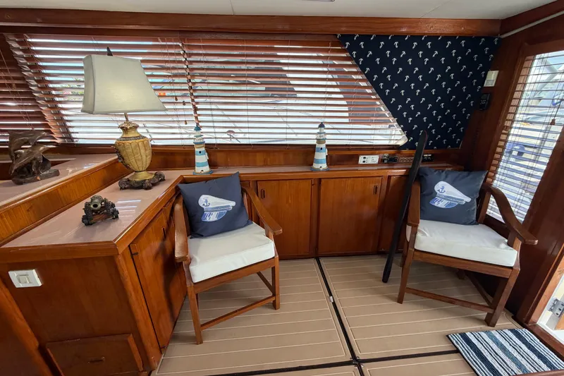 Slide: The Image of Interior of 1986 Bertram 46 Convertible yacht with nautical decor and wooden furnishings. - 12