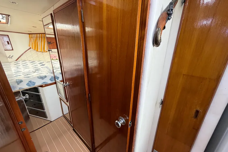 Slide: The Image of Interior of 1986 Bertram 46 Convertible yacht with wood paneling and cozy cabin. - 31