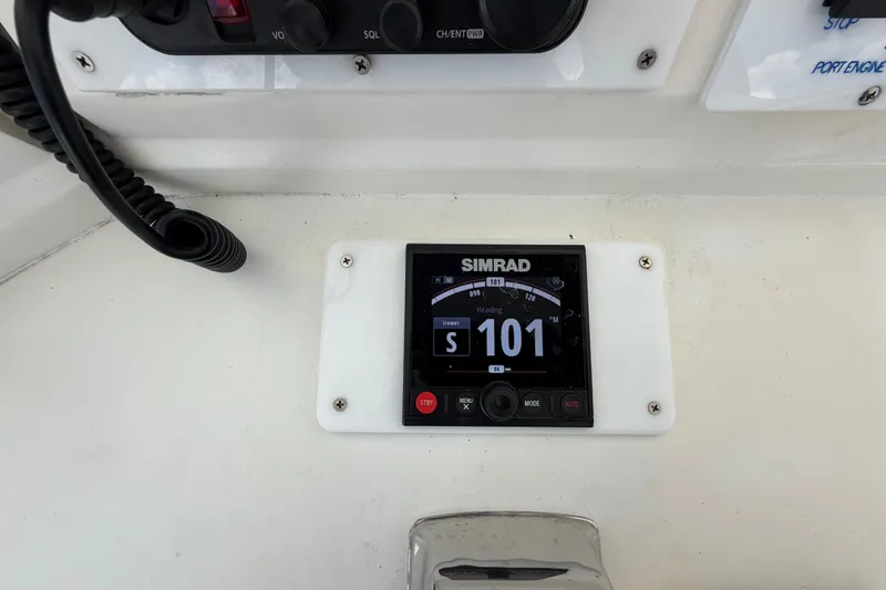 Slide: The Image of Simrad navigation display on 1986 Bertram 46 Convertible boat dashboard. - 77