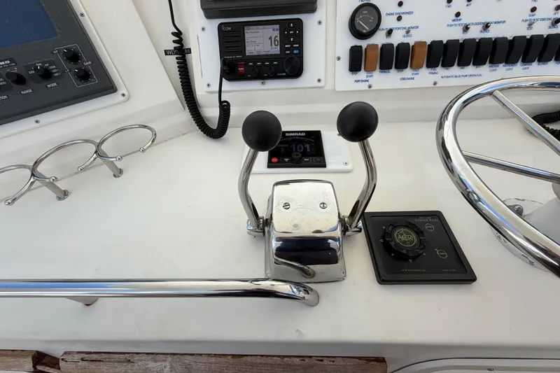 Slide: The Image of Control panel of a 1986 Bertram 46 Convertible yacht with navigation instruments. - 78