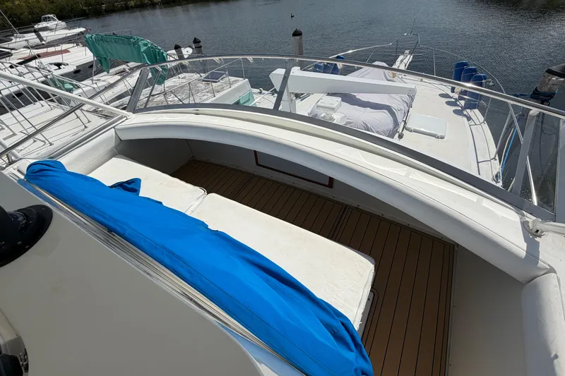 Slide: The Image of 1986 Bertram 46 Convertible yacht deck with seating and blue cover. - 83