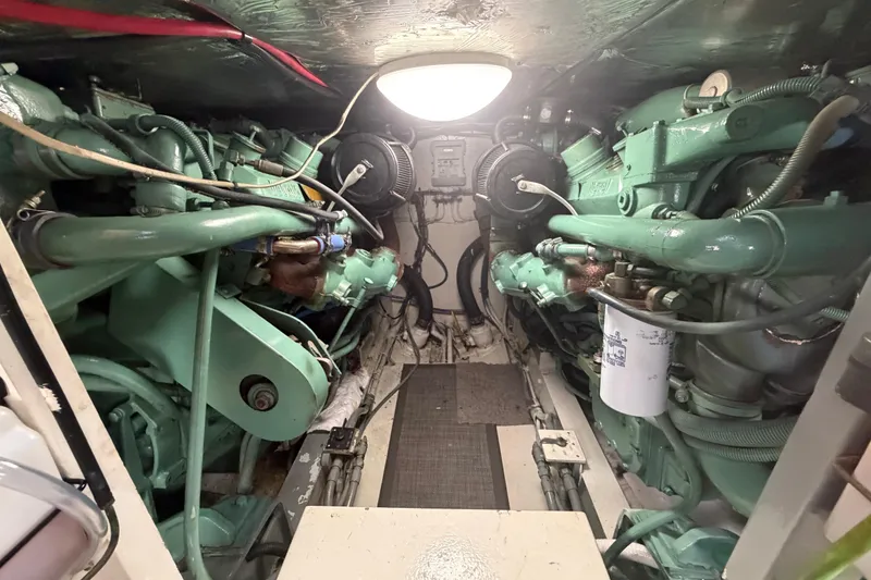 Slide: The Image of Engine room of a 1986 Bertram 46 Convertible yacht, showcasing dual engines. - 86