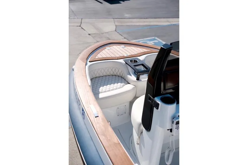 Slide: The Image of Luxurious 2018 Carbon Craft CC130 boat interior with elegant seating and wooden accents. - 3