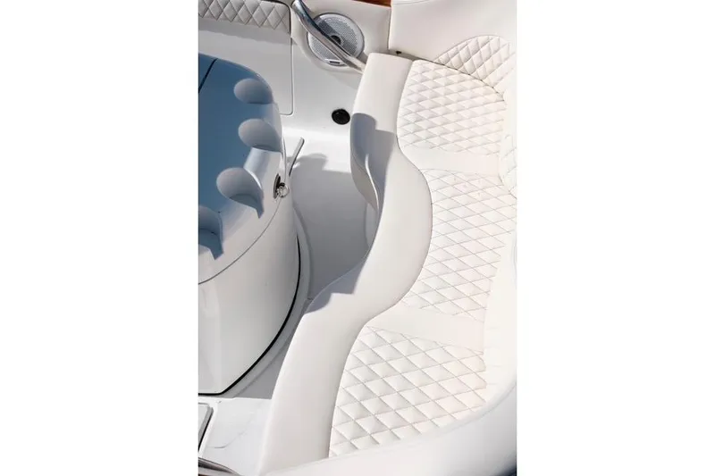 Slide: The Image of Luxurious white seating on a 2018 Carbon Craft CC130 boat. - 6