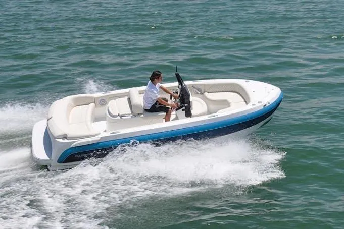 Slide: The Image of Carbon Craft CC130 boat cruising on water, 2018 model. - 7