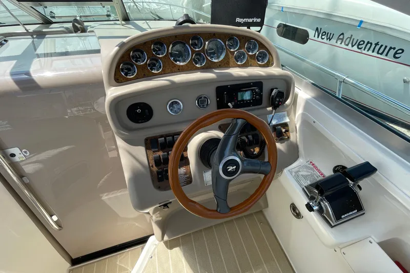 Slide: The Image of Luxurious interior of 1999 Sea Ray 290 Sundancer yacht with plush seating and elegant decor. - 13