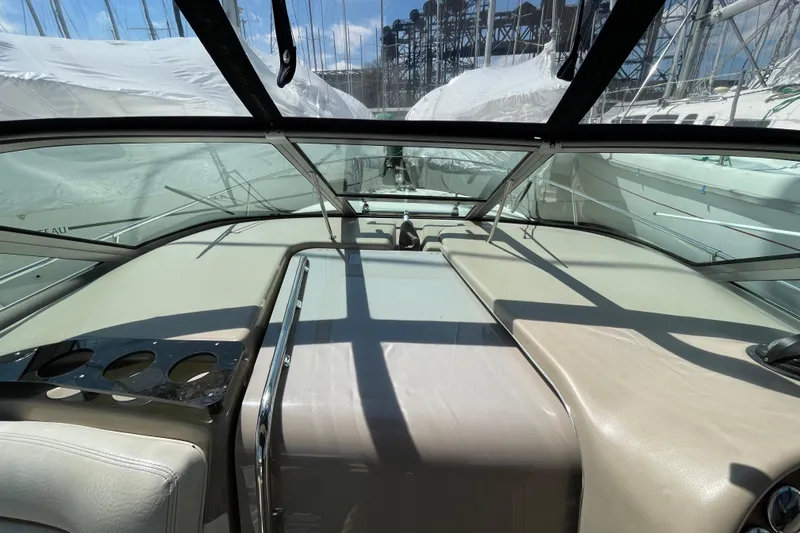 Slide: The Image of 1999 Sea Ray 290 Sundancer helm with gauges and navigation equipment. - 15