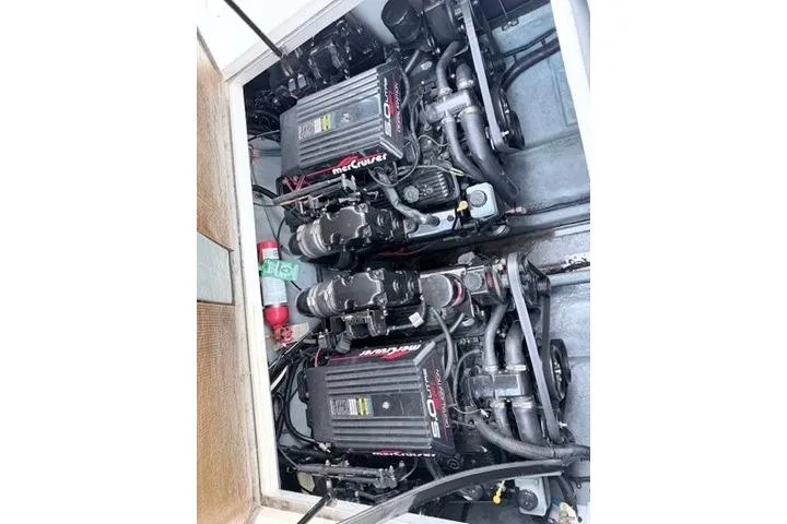Slide: The Image of Twin MerCruiser engines in a 1999 Sea Ray 290 Sundancer boat. - 37
