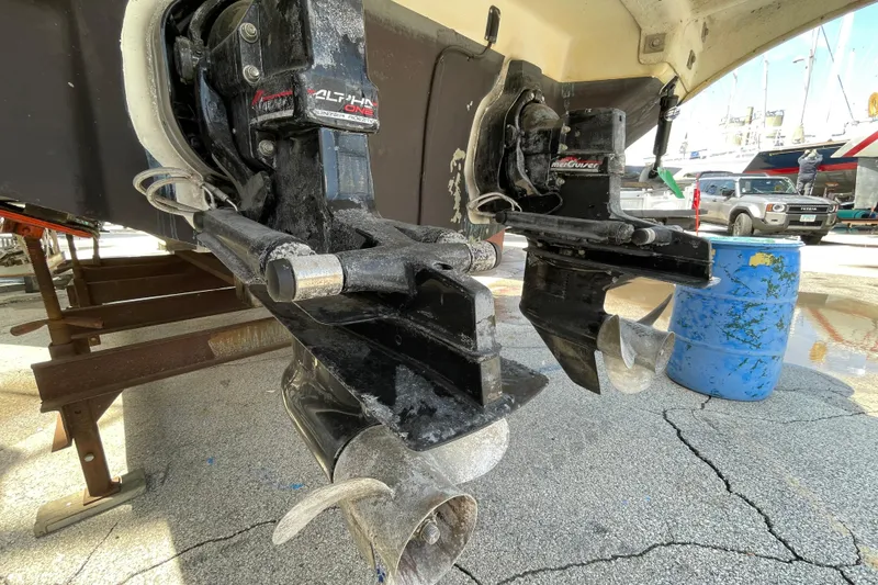 Slide: The Image of 1999 Sea Ray 290 Sundancer boat outdrives in a marina setting. - 6