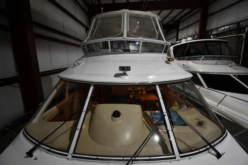 Slide: The Image of 2003 Cruisers Yachts 5000 Sedan Sport in storage, showcasing sleek design and spacious interior. - 11