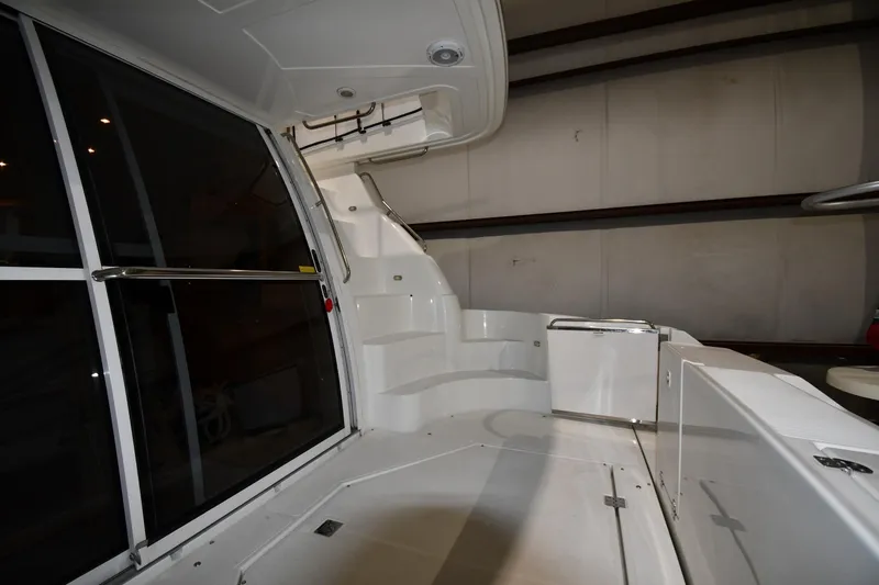 Slide: The Image of 2003 Cruisers Yachts 5000 Sedan Sport interior with sleek white design and modern features. - 12