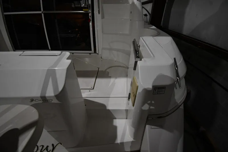 Slide: The Image of 2003 Cruisers Yachts 5000 Sedan Sport, white deck area with steps and railing. - 15