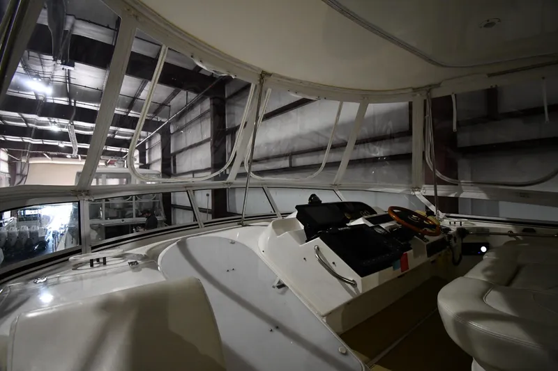 Slide: The Image of Interior view of 2003 Cruisers Yachts 5000 Sedan Sport helm in a warehouse. - 17