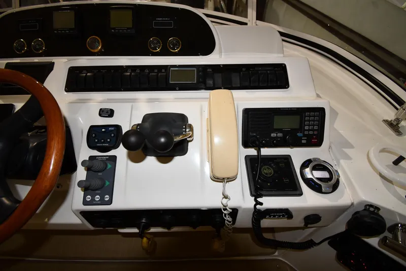 Slide: The Image of Control panel of a 2003 Cruisers Yachts 5000 Sedan Sport with navigation instruments. - 20