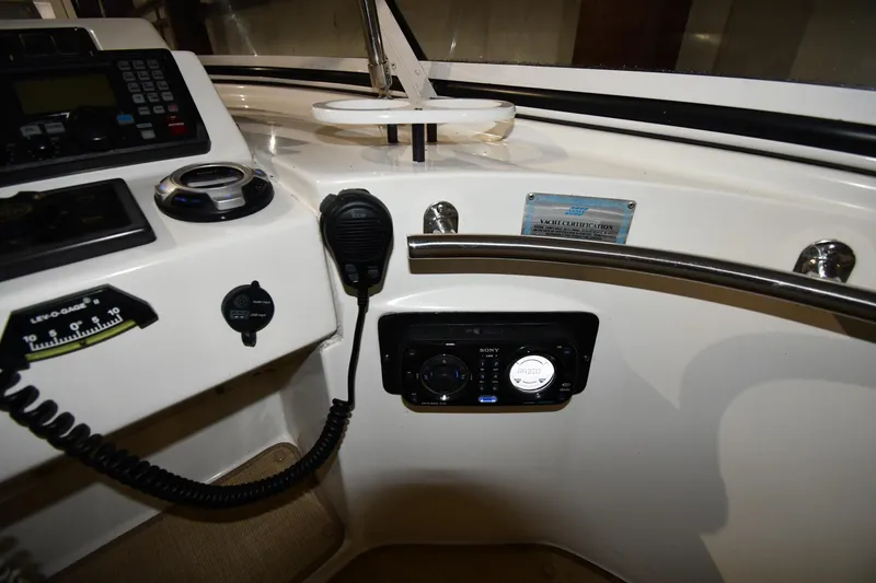 Slide: The Image of Control panel of a 2003 Cruisers Yachts 5000 Sedan Sport with radio and communication equipment. - 21